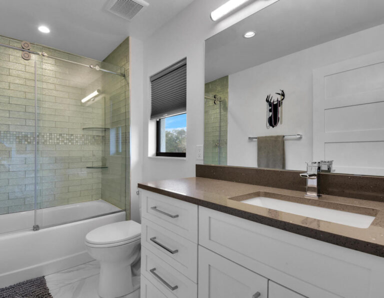 Remodeled bathroom with custom white bathroom vanity
